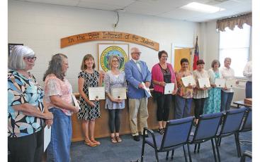 Press photo/Jake Browning - Macon County Schools has 41 teachers retiring this year. Some of the retiring teachers were recognized at the June School Board meeting.