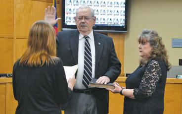 Press photo Mia Overton - Mayor Jack Horton is sworn in during the Dec. 4 Franklin Town Council meeting. Macon County Clerk of Court Shawna Thun Lamb administered the oath of office for the mayor and three council members.
