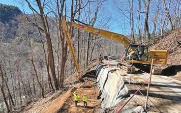 Photo/NCDOT - Crews work to fix the washed-out section of Highlands Road on Jan. 29.