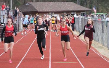 Press file photo - Sprint standouts Hope Smith (left) and Laura Covarrubias (right) compete in the 100-meter dash at Swain Nov. 15.
