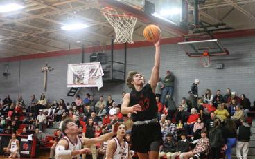 Press photo/Will Woolever - Freshman forward Will Rauers lays a shot off the glass at Andrews Jan. 3. 