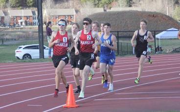 Press photo/Will Woolever - Seniors Logan Russo (left) and Barrett Stork lead the pack in the 1,600-meter run at Western Carolina University March 7. 
