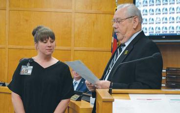 Press photo/Mia Overton - Franklin Town Clerk Nicole Bradley (left) listens as Mayor Jack Horton reads a proclamation for Municipal Clerks Week, May 5-11. In addition to serving as clerk to the Town Council, Bradley is the town’s human resources director.