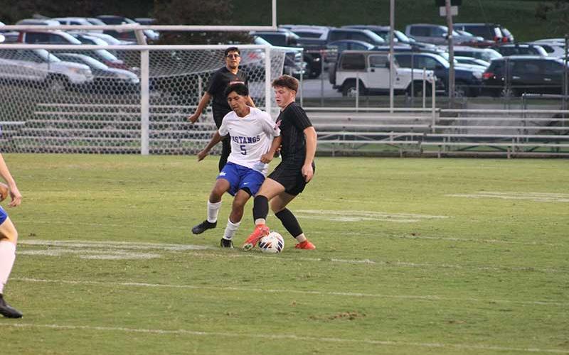 Senior left back Jaydon Pevia fights for possession against Smoky Mountain Sept. 25 at the Panther Pit. (Press photo/Will Woolever)