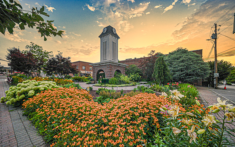 Photo/Bob Scott - Sunrise over Clock Tower Square on Main Street in Franklin. As part of its economic development efforts, the Town of Franklin is partnering with the new nonprofit Main Street Franklin, Inc. The town is also conducting a survey to get input on a separate project regarding the design and use of the Main Street area. The link for the survey is available at franklinnc.com.