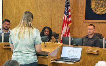 Press photo/Shelby Powell - Liz Birolin speaks to the Macon County commissioners to request they choose qualified members for the Macon County Library Board.