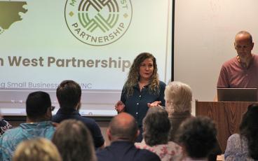 Press photo/Shelby Powell - Elissa Hashemi, director of Mountain West Partnership, speaks at the Eggs and Issues forum on support for small businesses.