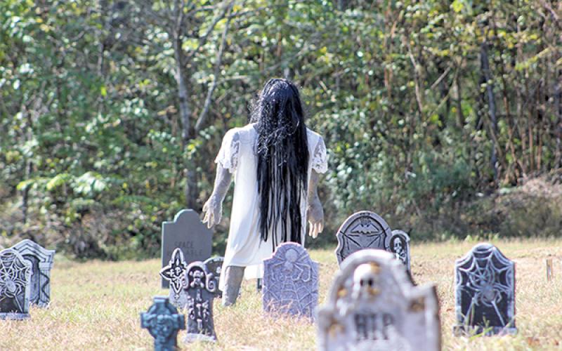 Press photo/Jake Browning - Bidwell Street residents put up elaborate Halloween scenes to welcome thousands of trick-or-treaters.