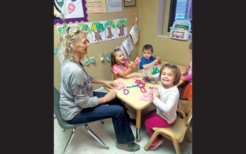 Photo submitted Bonnie Berk and her 3-year-old foster “grandchildren” at Long’s Chapel UMC in Waynesville.