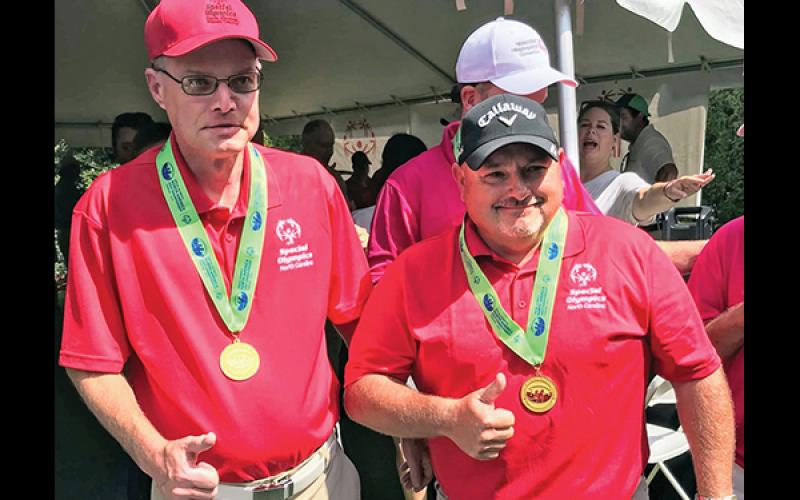 Golf partners Jason Hedrick and Eric Hall.