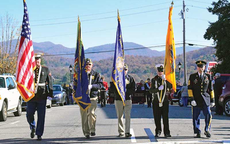 Press photo/Linda Mathias - Veterans march up Main Street during Monday’s Veterans Day Parade.