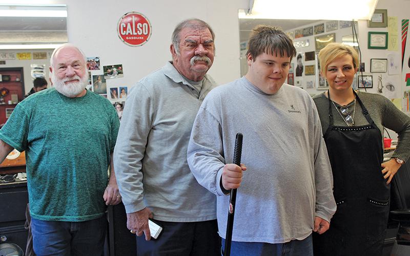 Press photo/Jake Browning - Ethan Hitchcock has been a valued member of the Modern Barber Shop team for two months now. From left: Fred McCaskey, Bob Bobber, Ethan Hitchcock and Courtney Blackburn.