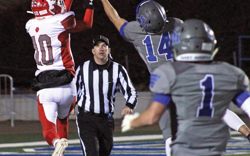 Press photo/Andy Scheidler - Franklin sophomore Devyn Blackburn tries to make a leaping grab but Smoky’s Dustin Stephens deflects the pass.