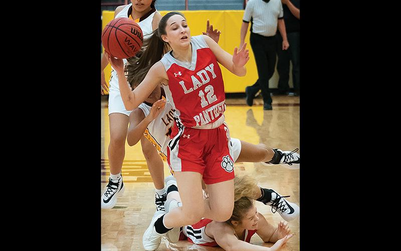 Press photo/Tom Pantaleo Franklin senior Chela Green goes to the floor after teammate Taylor Carlton and a Cherokee player collide. Green scored five points and grabbed six rebounds in the road victory.