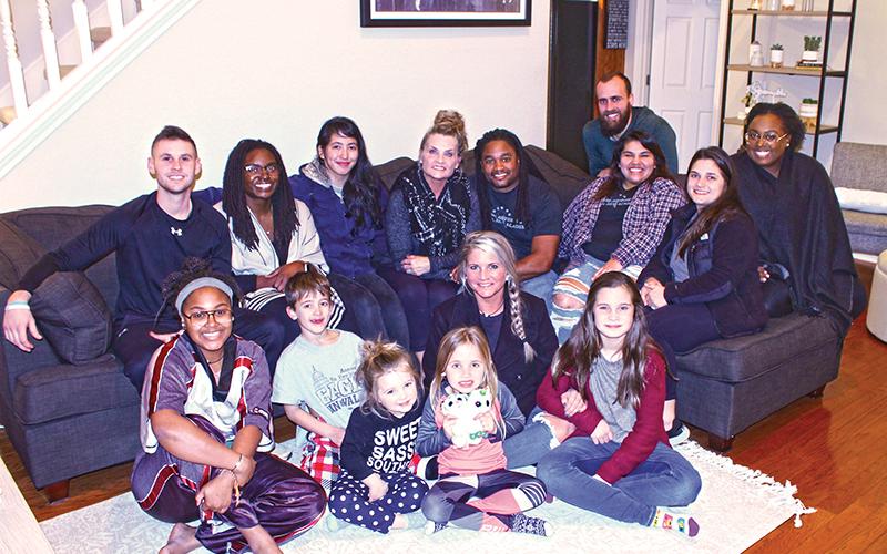 Press photo/Andy Scheidler - Danny and Mary Antoine sit surrounded by just some of their children.