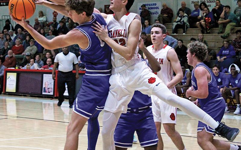 Press photo/Andy Scheidler Franklin’s Griffin Green gets called for a foul on this play. The sophomore made far more positive plays, however, including sinking six 3-pointers in the Panthers’ win Friday against Brevard. It was a career-high for the first-year varsity player.