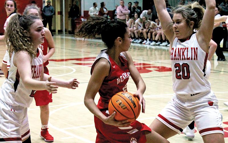 Press photo/Andy Scheidler - Taylor Carlton (20) and Kyndell Burns trap a Hendersonville player during Friday’s home game. The Panthers allowed only 31 points in the win.