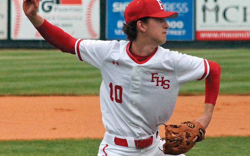 Press photo/Andy Scheidler Tanner Carlton throws to first after fielding a grounder in front of the mound during a Franklin home game last week. FHS went 3-0 before the NCHSAA ban on athletic contests.