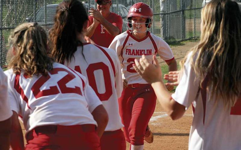 Press file photo - With teammates waiting at the plate, Taylor Carlton finishes a home run trot last season. She’ll play next year at Catawba Valley CC.