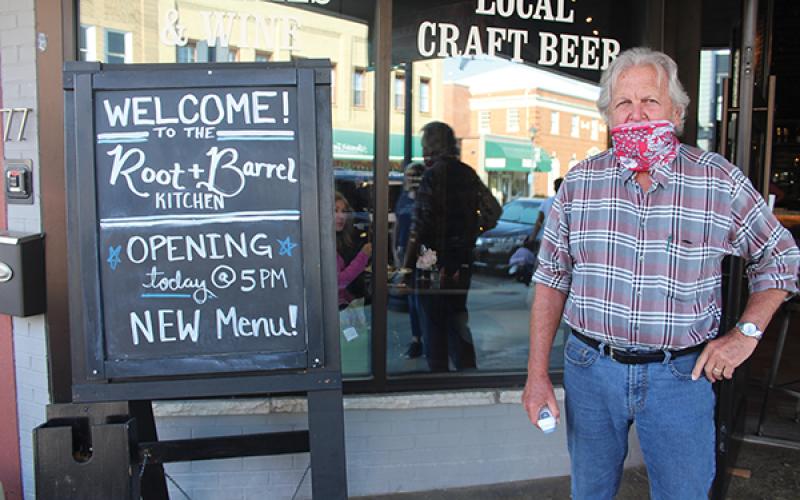 Press photo/Jake Browning - Root and Barrel owner Gary Murphy stands ready with a thermometer to check diners on Saturday, May 23.