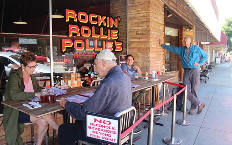 Press photo/Jake Browning - Rockin’ Rollie Pollies, in owner Roland Mock’s words, welcomed customers back “at 5:01 the day the governor said we could at 5”. From left, customers Amy Evans-Fisher, George Fisher, Virginia Brubeck and Phil Walker.