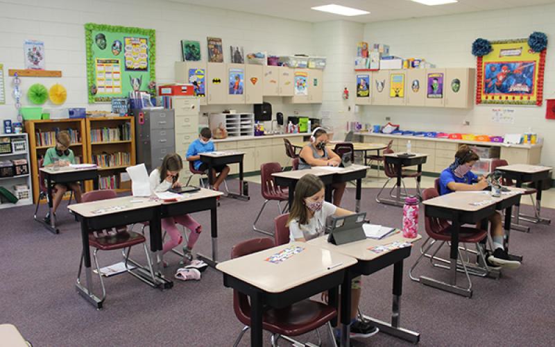Press photo/Jake Browning - Students in Cynthia Trawick’s fourth-grade class at Cartoogechaye Elementary School practice social distancing.