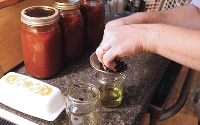 Press photos/Will Woolever - Laura Gamble revived a family tradition this year when she began canning vegetables from her home garden.