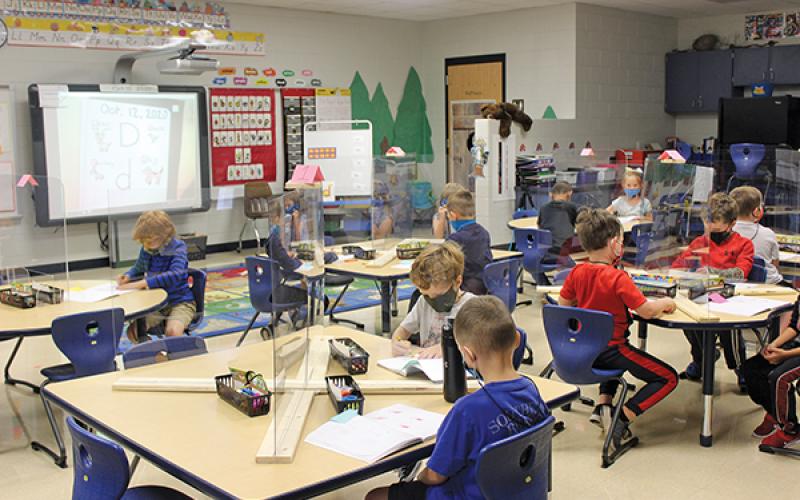 Press photo/Jake Browning Sheena Hughes’ kindergarteners at Iotla Valley Elementary School are in school for four days per week for the first time this year and are learning a lot from face-to-face instruction, albeit from behind plexiglass.