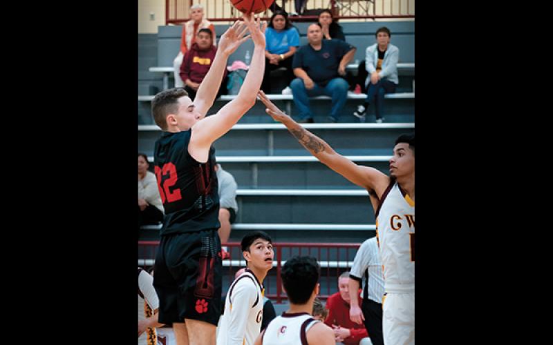 File photo - Franklin junior forward Miles McClure releases a shot during a game last season. McClure returns after leading the team in scoring and earning All-Mountain Six Conference honors.