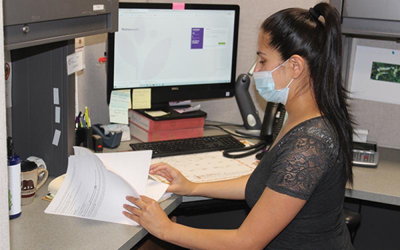 Press photo/Jake Browning - Ivonne Rios is in charge of medication assistance for the clinic