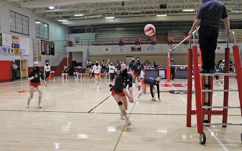 Press Photo/Will Woolever - Senior setter Rylee Corbin saves a ball in a match against East Henderson on Dec. 15.