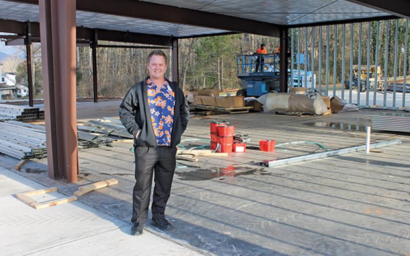 Press photo/Lee Buchanan - Smart Pharmacy owner Jacob Reiche stands at the site of his store’s future location at the Wayah Street/Maple Street roundabout.