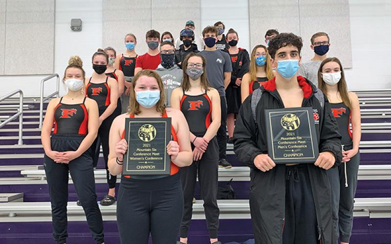 Press photo/Will Woolever - Members of the Franklin Swim and Dive Team show off two plaques certifying their Mountain Six Conference titles. The team will now prepare for the 2-A West Regional meet in Charlotte Feb. 5-6.