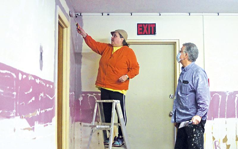 Press photo/Will Woolever -  Ann Marie McWhite and Doug Cross work on the Arise and Shine Thrift Store located in the Carson Community Center.