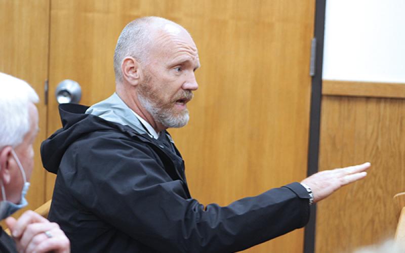Press photo/Jake Browning - Macon County Schools superintendent Chris Baldwin addresses the county commissioners at a special called meeting on Feb. 26.