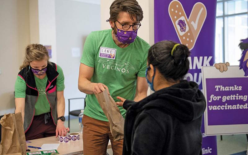 Press photo/submitted - Lane Perry, director of WCU’s Center for Community Engagement and Service Learning, and Cortnee Lingerfelt, director of the WCU Vaccine Clinic partnered with Vecinos to vaccinate 100 farmers in WNC against Covid-19.