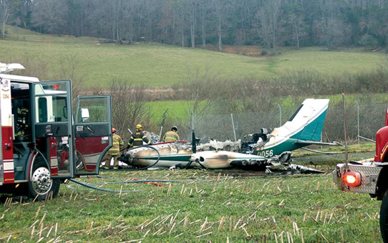 Press photo/ Will Woolever - A small twin-engine Cessna crashed at the Macon County Airport on Thursday afternoon. Emergency response units extinguished the fire and secured the scene. The pilot and two passangers were unharmed.