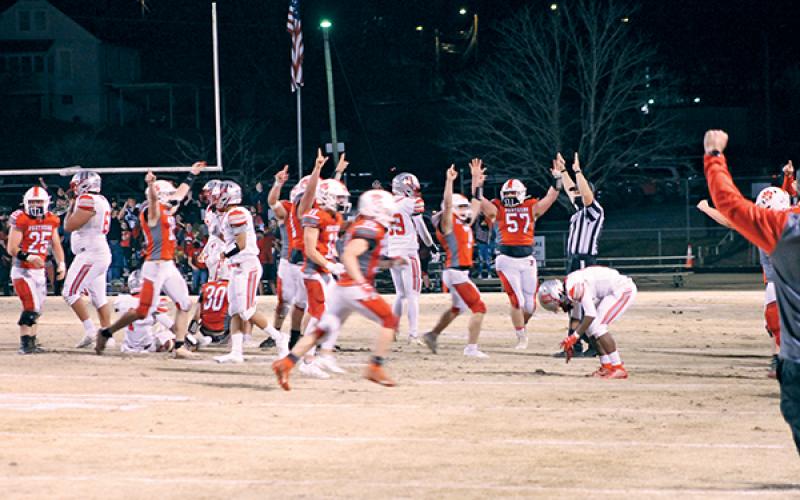 Press Photo/Will Woolever Panther players celebrate after making the final tackle to cement their stunning win over Hendersonville.