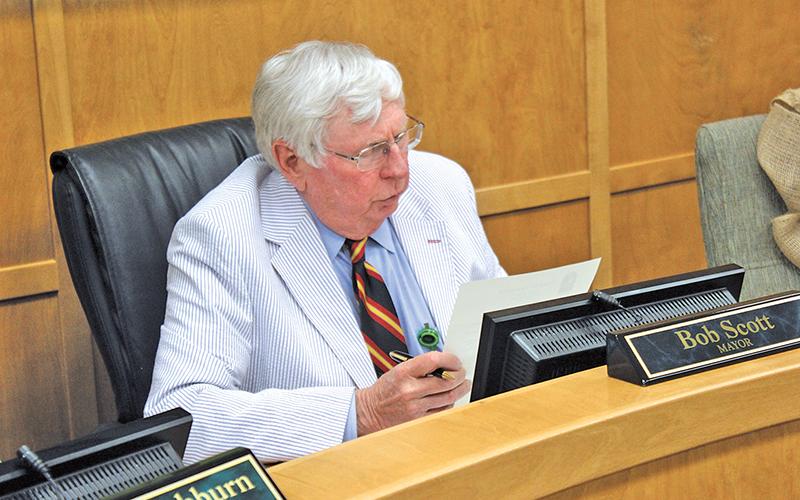 Press photo/ Jake Browning - Franklin Mayor Bob Scott reads a proclamation honoring former town council member and vice-mayor Barbara McRae.