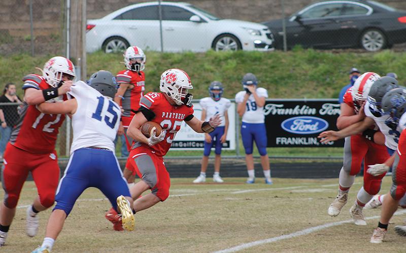 Press Photo/Will Woolever - Senior fullback/outside linebacker Evan Klatt carries against Smoky Mountain in the final game of his Panthers career April 9. Klatt went out with a bang, recording 183 yards and 4 touchdowns on 27 carries.