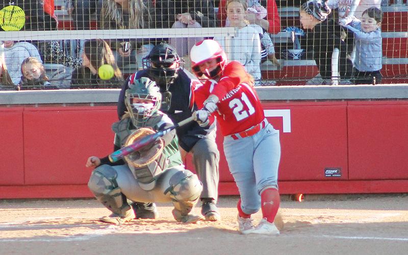 Senior second baseman Nevaeh Tran belts a home run against East Henderson April 22. Tran hit two two-run homers in the game.