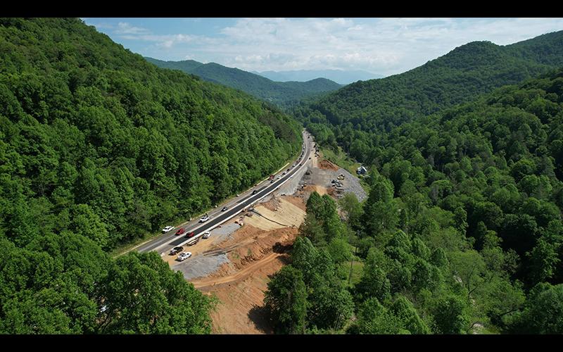 Photo/Eric Haggart - Aerial views show the extent of the road repair work on Cowee Mountain, which has traffic down to one lane in each direction.