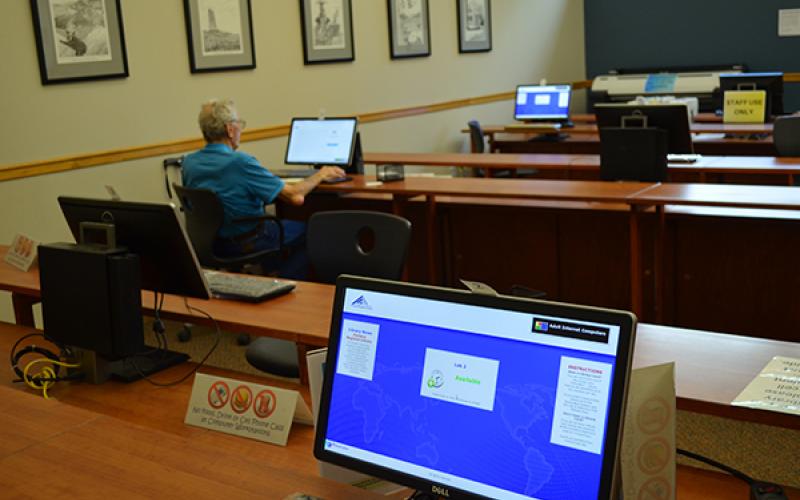 Press photo/Mia Overton - The federal government’s American Rescue Plan includes $7.2 billion that could be allocated to state and local governments to reimburse libraries and schools for providing free broadband access to students’ homes. Computer labs such as this one at Macon County Public Library provide a much-needed service for people who do not have computers or internet access at home.