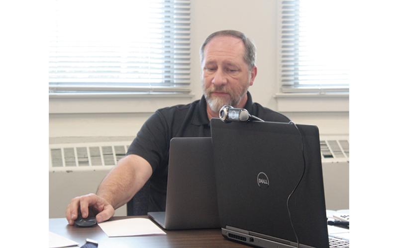 Press photo/Jake Browning - Information Technology Director Tim Burrell reviews Macon County Schools’ cyber security measures.