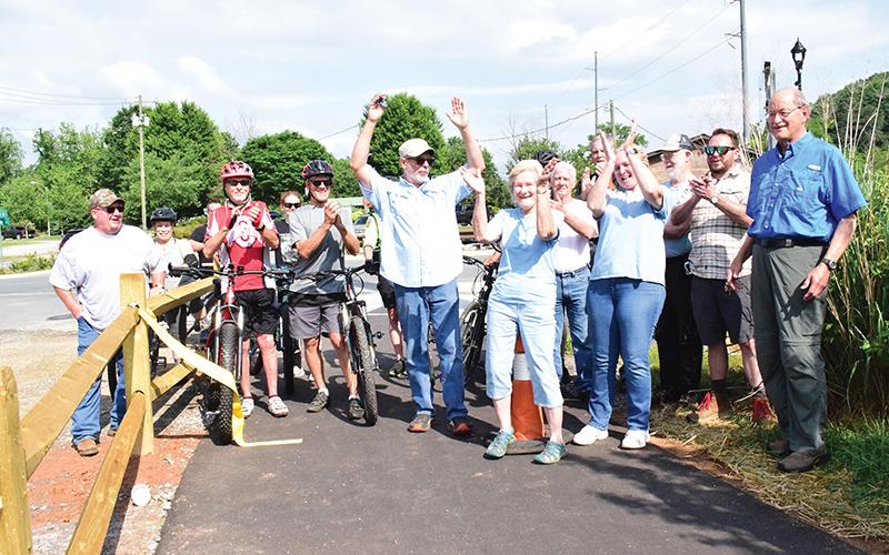 Press photos/Linda Mathias  - The Friends of the Greenway celebrate completion of the Greenway connector at a rally on June 12.