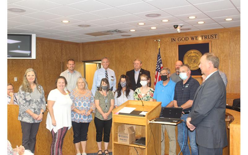 Press photo/Jake Browning - Employees and volunteers at the Macon County COVID-19 Vaccine Call Center were recognized for providing more than 800 hours of service to the county and answering over 23,000 calls earlier this year.