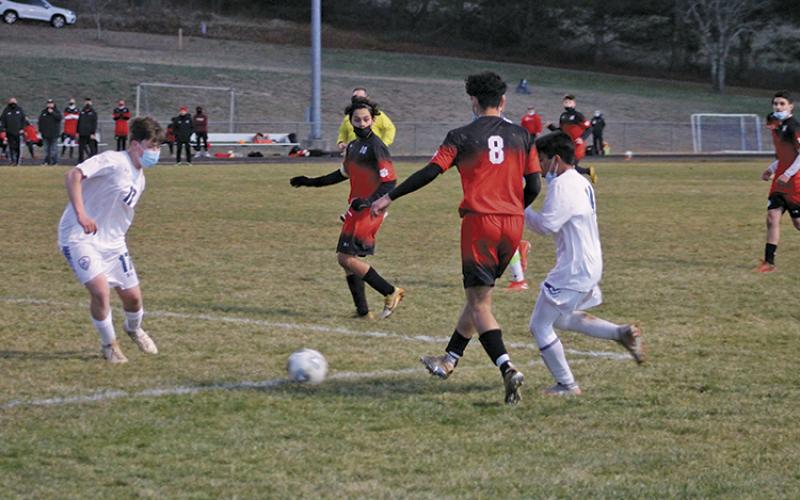 Press photo/Will Woolever - FHS All-Mountain Six selections Solomon Espinal (center, left) and Luis Torres try to slice through the Smoky Mountain defense in a game at Macon Middle School last season.