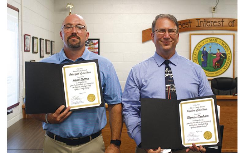 Press photo/Jake Browning - Mark Sutton (left) of Macon Early College was recognized as Principal of the Year and Thomas Graham of Macon Middle School received Teacher of the Year honors at the School Board meeting on Aug. 23. Christina Tallent, a teacher assistant at Cartoogechaye Elementary School, was named Support Person of the Year.