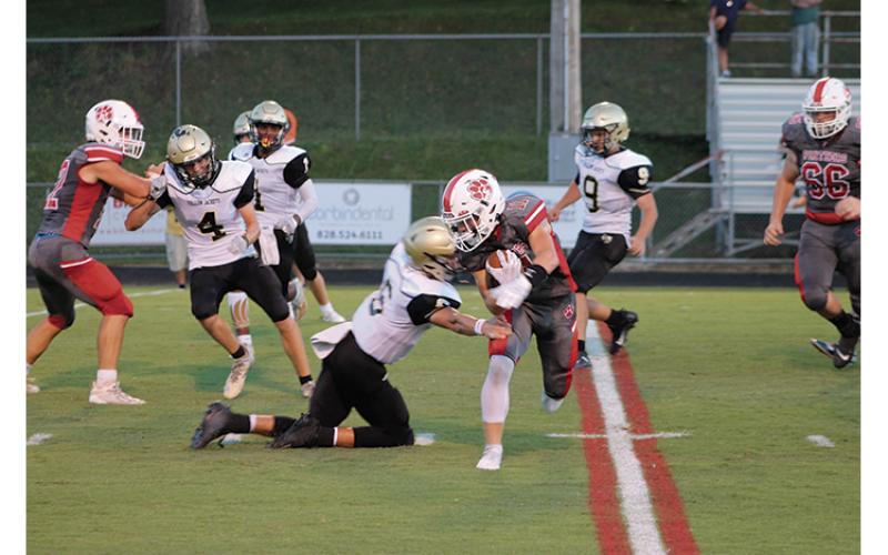 Press Photo/Will Woolever - Senior wide receiver/defensive back Grant Adams attempts to shed a tackle against Hayesville Aug. 27. Adams was named this week’s Wayah Insurance Player of the Game after catching the game-winning interception against Swain.