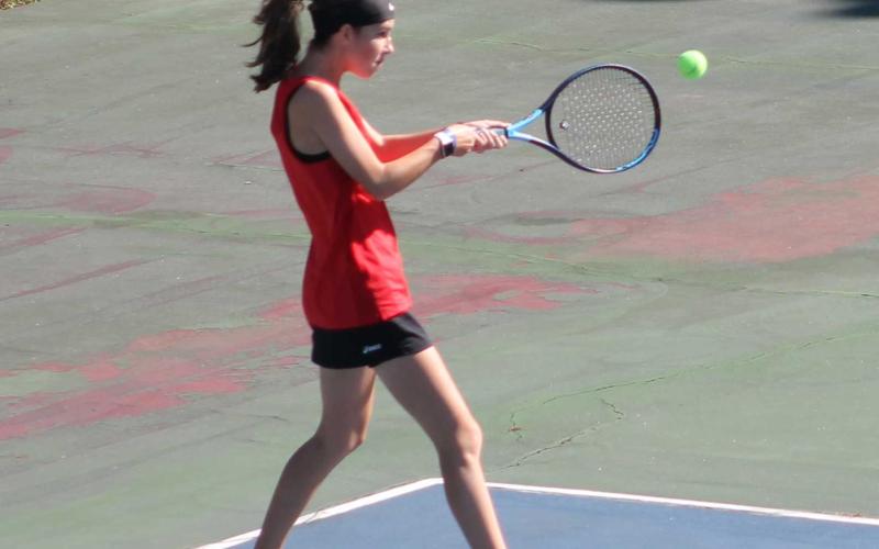 Press Photo/Will Woolever - Freshman Maci Stork attempts a backhand against West Henderson Oct. 9.